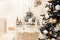 Stylish christmas living room interior with curved furniture, christmas tree and wreath, stars