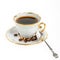 Stylish coffee cup with silver spoon and seed