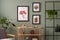 The stylish composition at living room interior with wooden console and elegant personal accessories. Mock up poster. Green wall.