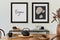 Stylish composition of modern kitchen interior design with mock up poster frames, black console, teapot and kitchen accessories.