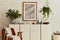 Stylish composition of modern living room interior with mock up poster frame, wooden sideboard, armchair, plants and vintage.