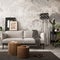 The stylish compostion at concrete living room interior with design gray sofa, wooden coffee table, desk and elegant personal