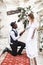 Stylish couple newlyweds, joyful moment. Bride and groom near the wedding arch on a background desert canyon in boho