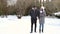 Stylish couple walking and having fun in the countryside in winter