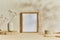 Stylish cozy minimalistic interior design with mock up poster frame, natural materials as wood and marble, dry plants and personal