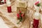 Stylish decorated golden bottles of wine with red flowers and la