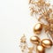 Stylish Easter gold eggs with golden dried flax linum bunch, white background