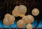 Stylish electrical lanterns spheres hanging out from dark brown ceiling