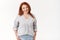 Stylish elegant redhead middle-aged 45s woman cheerful lucky mother standing white background tilt head smiling joyfully