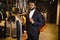 A stylish elegantly dressed African-American man working at classic menswear store