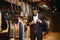 A stylish elegantly dressed African-American man working at classic menswear store