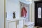 Stylish entrance hall with closet, storage bench and hanger stand