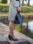 Stylish European young woman in a raincoat,