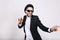 Stylish excited guy in suit, hat, black sunglasses having fun on white background. Leisure, weekends, cheerful mood, joy