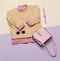 Stylish female clothes set. Woman/girl outfit on stylish background. Pink color. Handbags, sunglasses, watches. Sweater