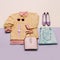 Stylish female clothes set. Woman/girl outfit on stylish background. Pink color. Handbags, sunglasses, watches. Sweater