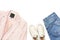 Stylish feminine spring clothing white shirt, blue jeans, pink corduroy jacket, beige espadrilles, watches on white background.