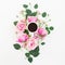 Stylish floral composition made of pink roses, buds and mug of black coffee on white background. Flat lay, Top view.