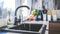 A stylish and functional modern kitchen sink, complete with a running faucet. Ai Generated