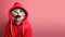 Stylish funny cat in a fashionable red sweatshirt with an open mouth on pink background
