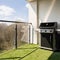 Stylish gas grill on spacious terrace