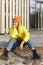 Stylish girl wearing yellow puffer and orange knitted hat