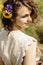 stylish gorgeous rustic bride with bouquet in sunny sunflower field