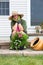 Stylish Grandma in gumboots and sunhat