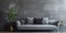 Stylish gray velvet sofa against stucco wall. Interior design of modern living room