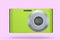 Stylish greeb compact pocket digital camera isolated on pink background