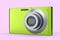 Stylish greeb compact pocket digital camera isolated on pink background