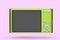 Stylish greeb compact pocket digital camera isolated on pink background