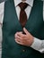Stylish green groom jacket close-up