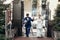 Stylish groom and bride walking and holding hands in city street, hugging and embracing. wedding day concept. beautiful wedding