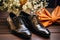 stylish groom shoes next to an elegant boutonniere