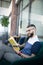 Stylish handsome businessman sitting and reading book