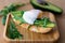 Stylish healthy breakfast of an avocado, arugula and poached egg toast on a wooden surface
