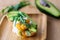 Stylish healthy breakfast of an avocado, arugula and poached egg toast on a wooden surface