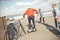 Stylish hipster boy riding gyroboard with friends near by