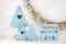 Stylish home decor in blue is a wooden basket, decorative nesting boxes and a cute rabbit. Easter decorations. Summer village comp