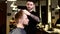 Stylish interior: Barber dries hair client that