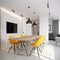 Stylish interior of a bright modern dining room with yellow elements. Spacious functional dining room interior design with a big