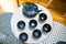 Stylish Interior Decoration of a Cast Iron Teapot with Dragonfly Decoration and Round Cups on Geometric Tables