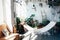 Stylish interior with houseplants and a hammock