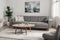 Stylish interior living room with comfortable gray color real photo modern sofa tv carbinet dinning table