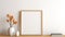 Stylish korean interior of living room with white mock up poster frame, elegant accessories, air plant, wooden shelf and vase with