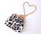 Stylish leopard bag with a heart-shaped chain