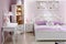 Stylish lilac bedroom with double bed