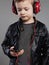 Stylish little boy in headphones.handsome child listening music