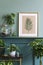 Stylish living room with mock up photo frame on the green shelf.